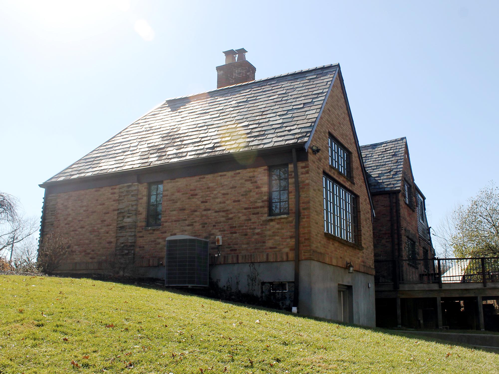 After Family room addition brick, stone, slate roof Wilcox Architecture